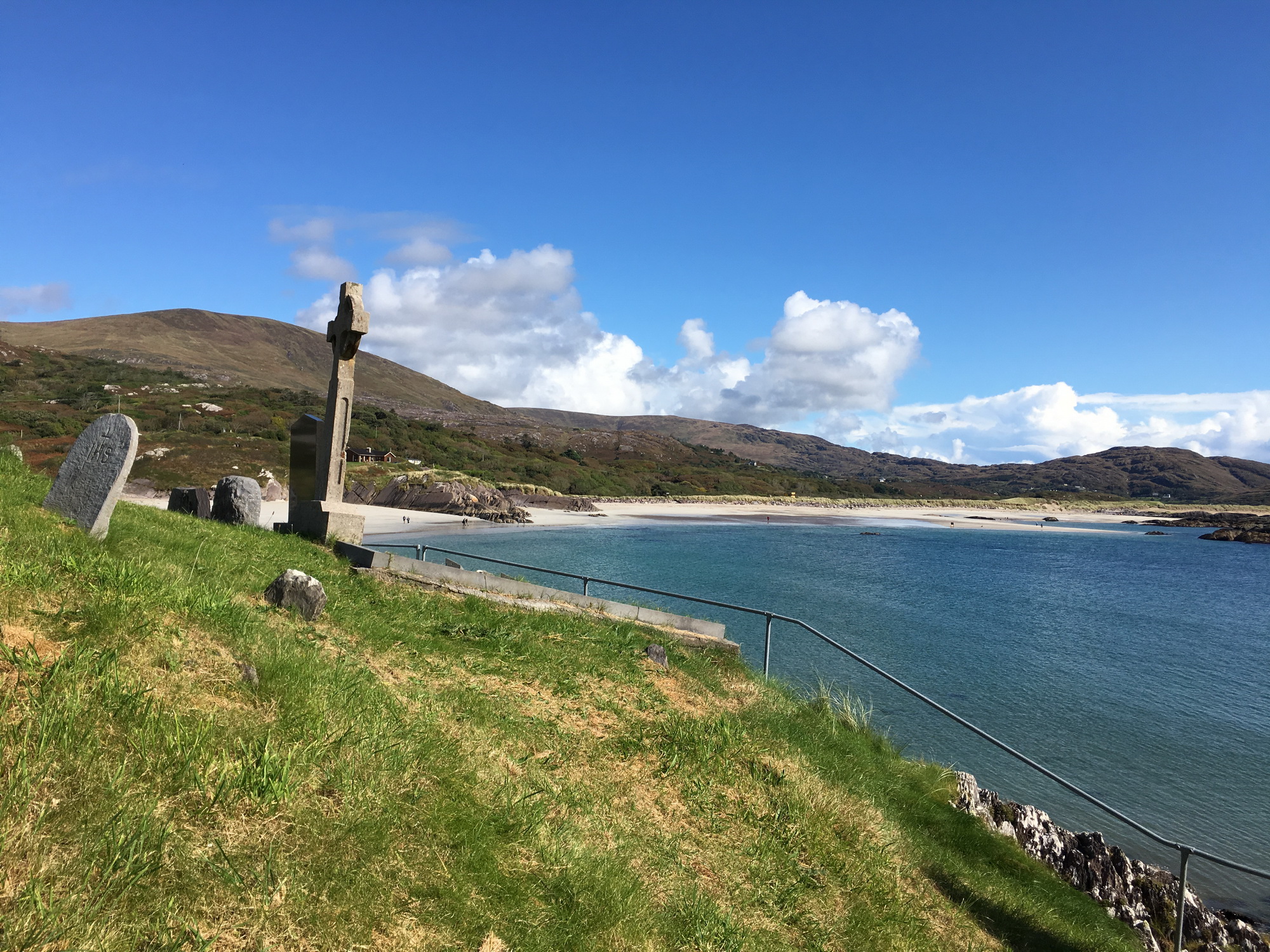 A gravestone looks over Derrynane Beach